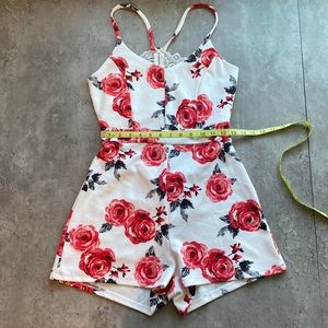 Floral romper with lace racer back.
